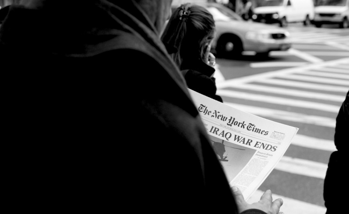 Documentation of the distribution of the New York Times Special Edition. Photograph by Conway Liao. Courtesy of Steve Lambert.